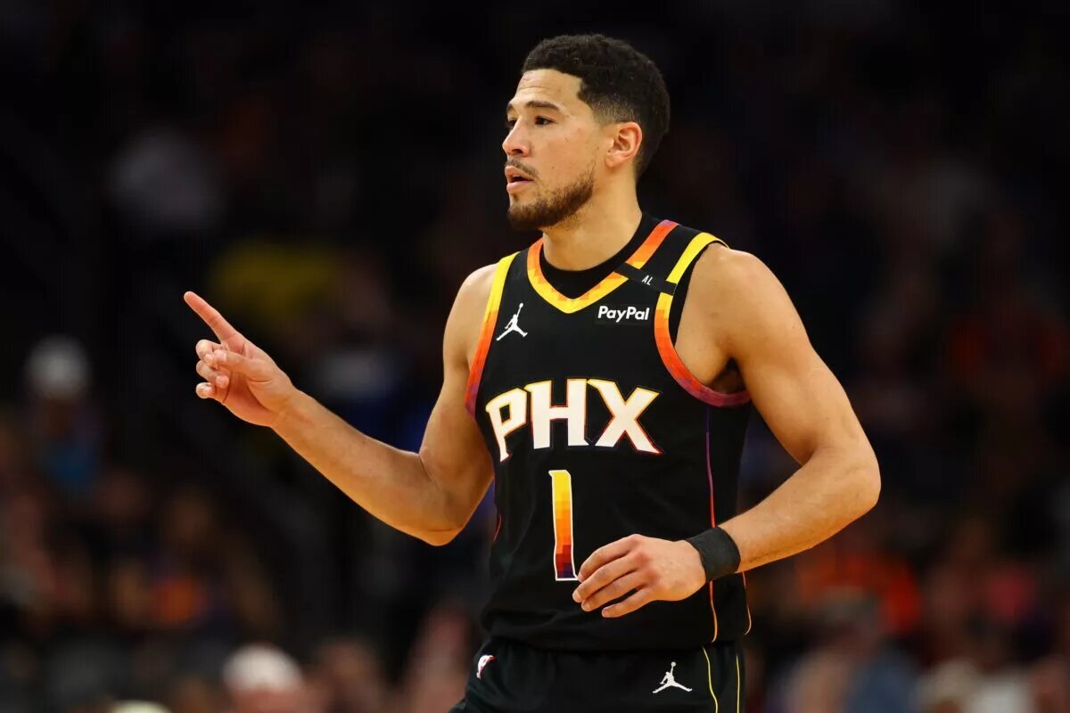 Apr 9, 2025; Phoenix, Arizona, USA; Phoenix Suns guard Devin Booker (1) reacts after a play against the Oklahoma City Thunder during the first half at Footprint Center. Mandatory Credit: Mark J. Rebilas-Imagn Images