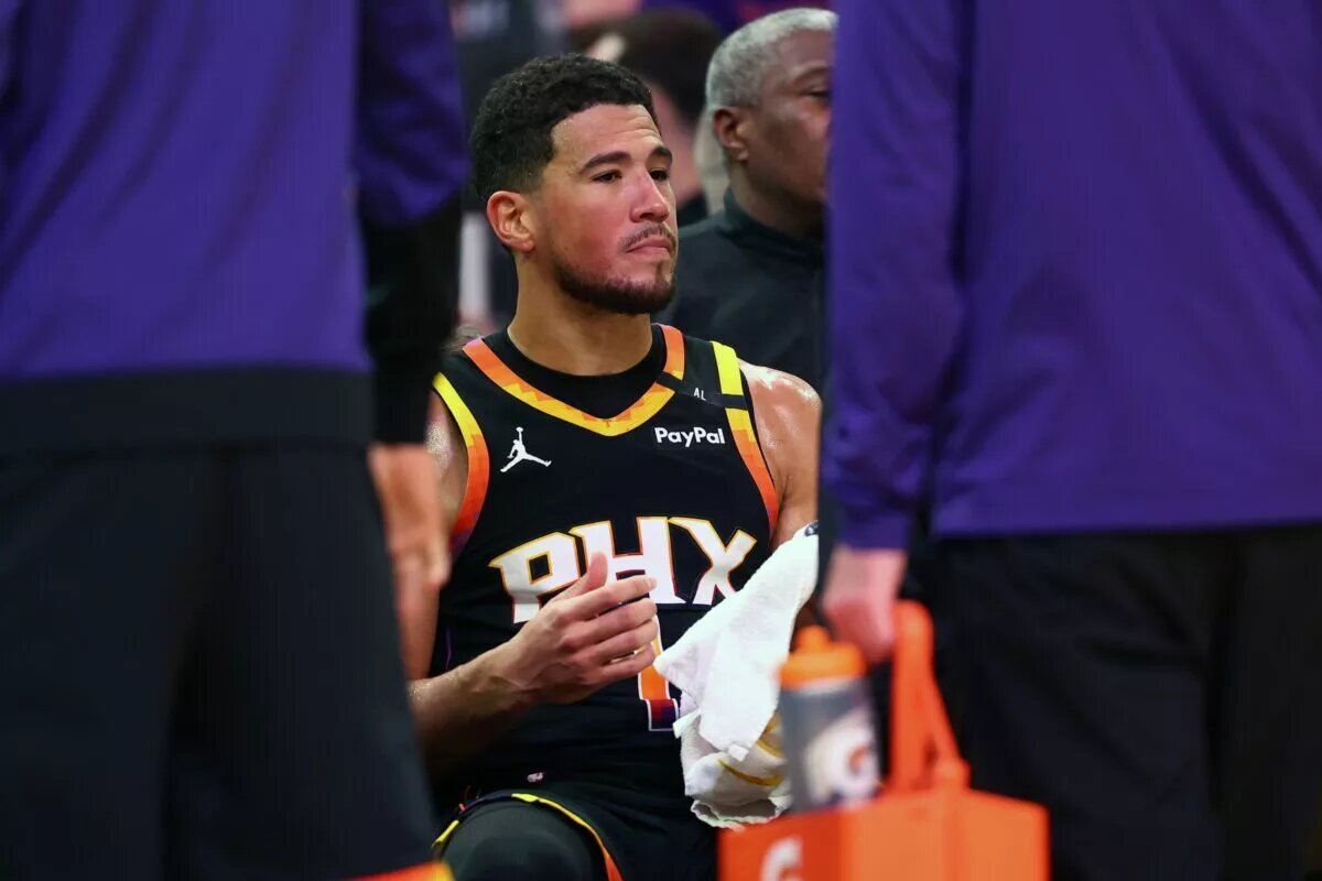 Apr 9, 2025; Phoenix, Arizona, USA; Phoenix Suns guard Devin Booker (1) reacts on the bench against the Oklahoma City Thunder during the second half at Footprint Center. Mandatory Credit: Mark J. Rebilas-Imagn Images