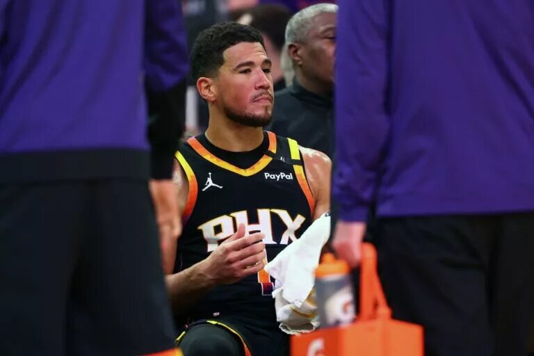 Apr 9, 2025; Phoenix, Arizona, USA; Phoenix Suns guard Devin Booker (1) reacts on the bench against the Oklahoma City Thunder during the second half at Footprint Center. Mandatory Credit: Mark J. Rebilas-Imagn Images