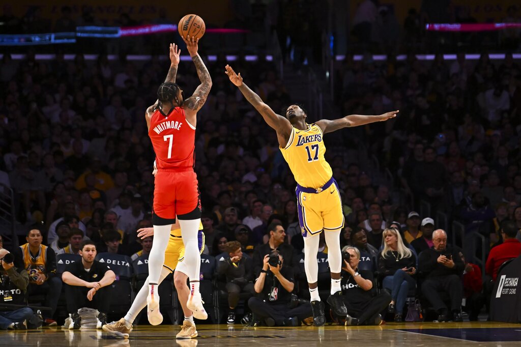 Apr 11, 2025; Los Angeles, California, USA; Los Angeles Lakers forward Dorian Finney-Smith (17) attempts to block against Houston Rockets forward Cam Whitmore (7) during the first half at Crypto.com Arena. Mandatory Credit: Jonathan Hui-Imagn Images