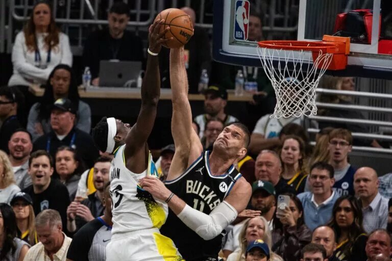 Apr 22, 2025; Indianapolis, Indiana, USA;Milwaukee Bucks center Brook Lopez (11) blocks the shot of Indiana Pacers forward Pascal Siakam (43) during game two of first round for the 2024 NBA Playoffs at Gainbridge Fieldhouse. Mandatory Credit: Trevor Ruszkowski-Imagn Images