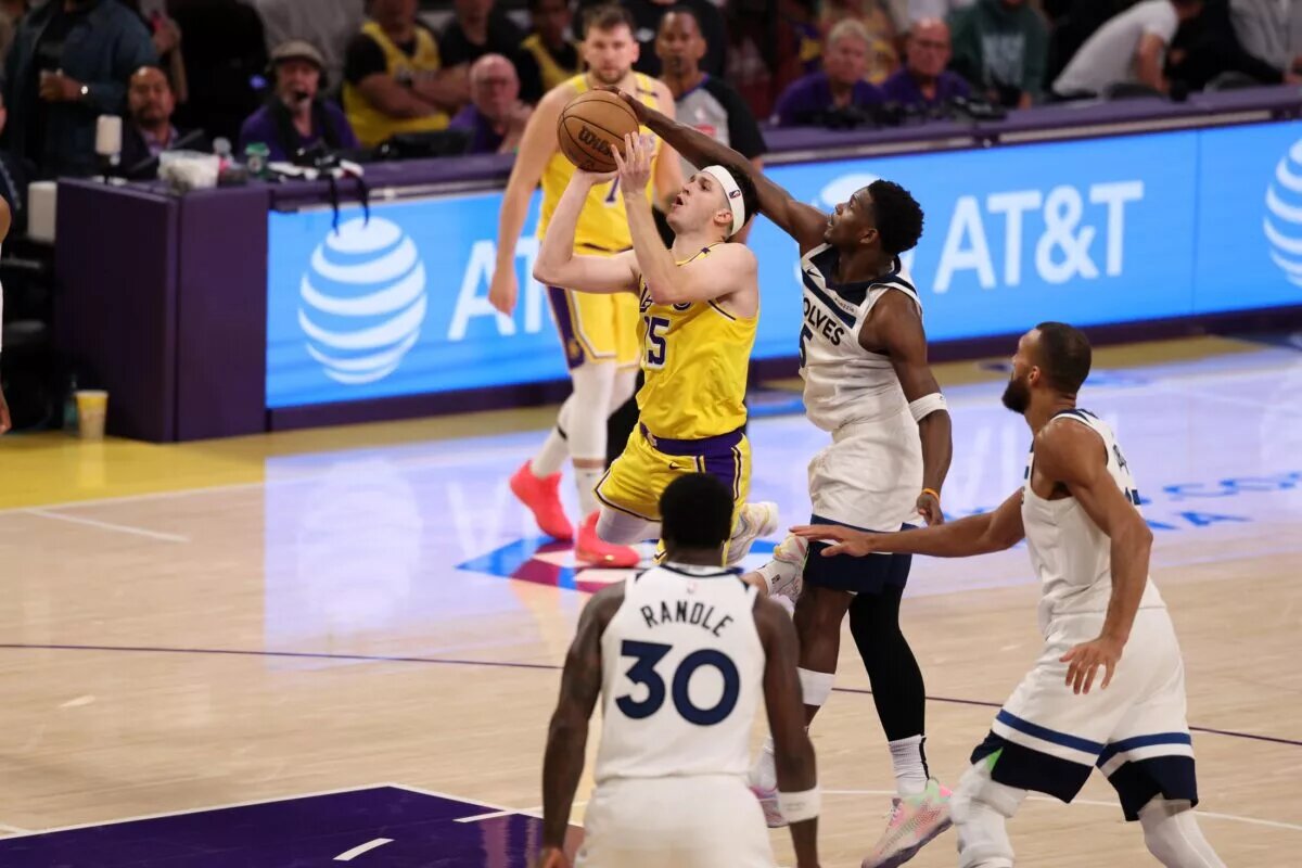 Apr 22, 2025; Los Angeles, California, USA; Los Angeles Lakers guard Austin Reaves (15) is fouled by Minnesota Timberwolves guard Anthony Edwards (5) during the third quarter of game two of first round for the 2024 NBA Playoffs at Crypto.com Arena. Mandatory Credit: Kiyoshi Mio-Imagn Images