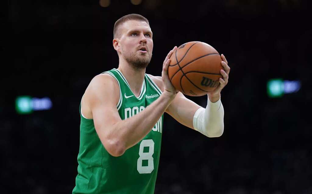 May 7, 2025; Boston, Massachusetts, USA; Boston Celtics center Kristaps Porzingis (8) shoots a free throw against the New York Knicks in the second half during game two of the second round for the 2025 NBA Playoffs at TD Garden. Mandatory Credit: David Butler II-Imagn Images