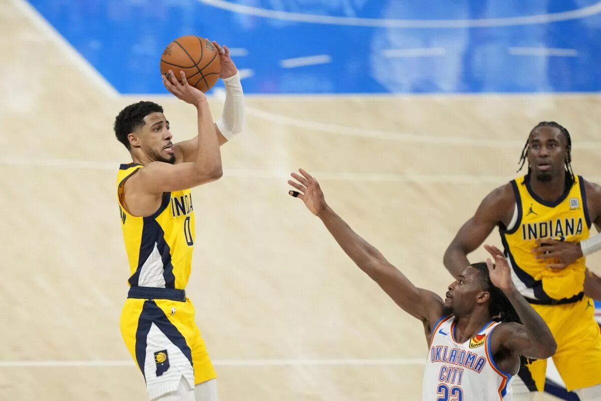 Jun 5, 2025; Oklahoma City, Oklahoma, USA; Indiana Pacers guard Tyrese Haliburton (0) shoots the ball against Oklahoma City Thunder guard Cason Wallace (22) during the fourth quarter in game one of the 2025 NBA Finals at Paycom Center. Mandatory Credit: Kyle Terada-Imagn Images