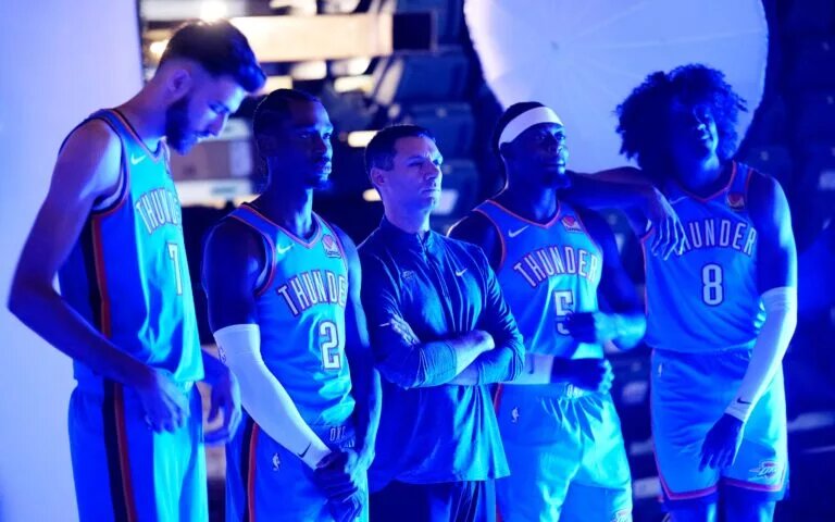 From left: Chet Holmgren, Shai Gilgeous-Alexander, coach Mark Daigneault, Luguentz Dort and Jalen Williams pose for a photo during Thunder media day Monday, Sept. 30, 2024, at Paycom Center.