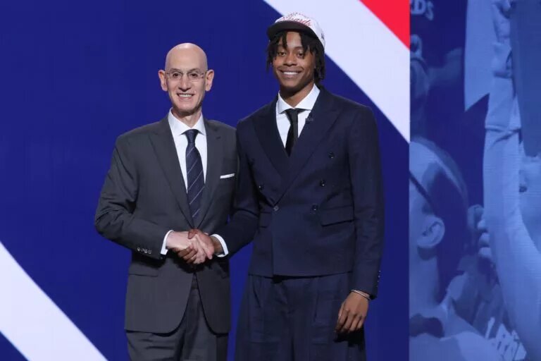 Jun 25, 2025; Brooklyn, NY, USA; Tre Johnson stands with NBA commissioner Adam Silver after being selected as the sixth pick by the Washington Wizards in the first round of the 2025 NBA Draft at Barclays Center. Mandatory Credit: Brad Penner-Imagn Images