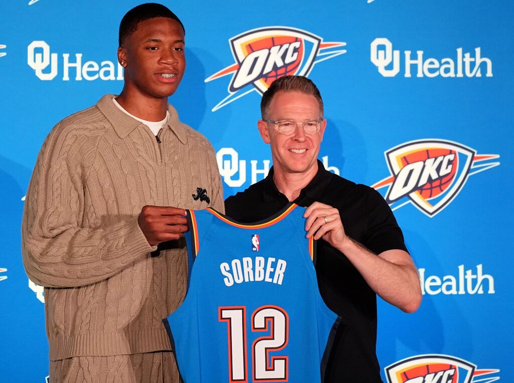 Thunder draft pick Thomas Sorber poses for a photo with general manager Sam Presti during a press conference at the First American's Museum in Oklahoma City, Saturday, June 28, 2025. © SARAH PHIPPS/THE OKLAHOMAN / USA TODAY NETWORK via Imagn Images