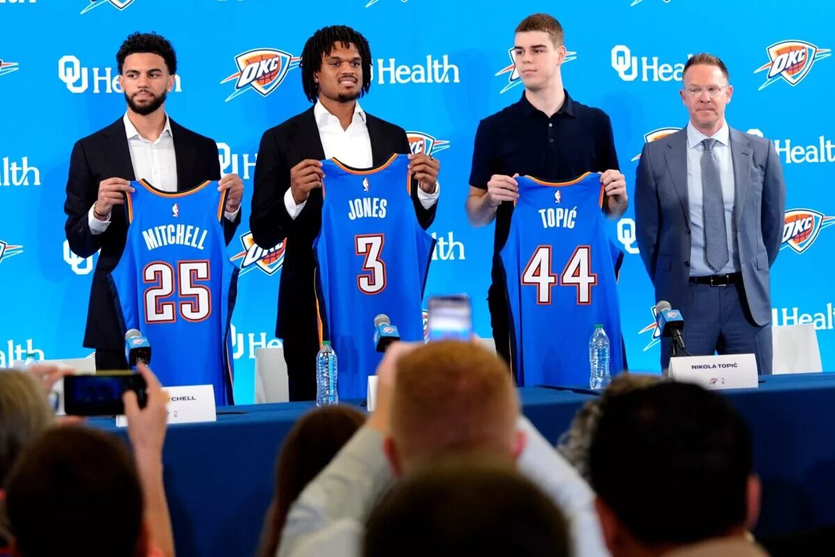 From left, Ajay Mitchell, Dillon Jones and Nikola Topic stand with Thunder general manager Sam Presti during an introductory press conference for the 2024 Thunder draft picks at Oklahoma Contemporary Arts Center in Oklahoma City, Saturday, June, 29, 2024.