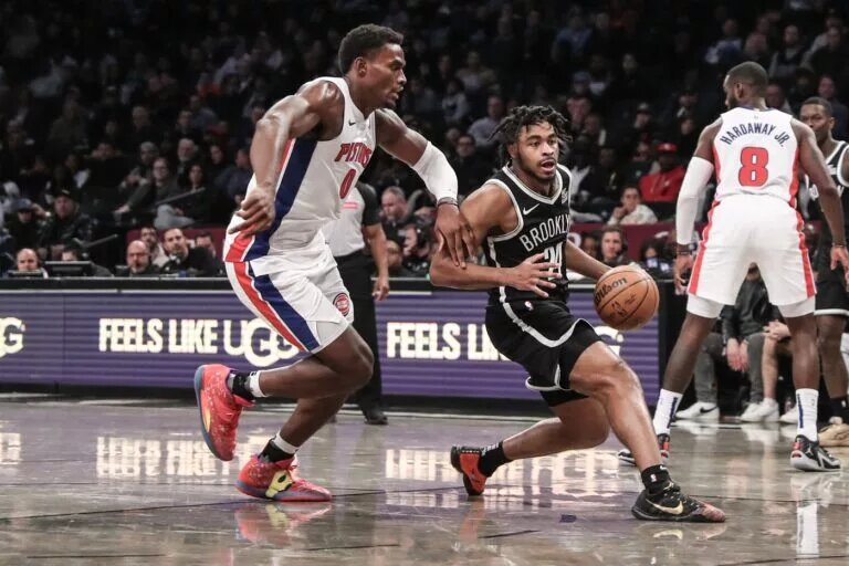 Nov 3, 2024; Brooklyn, New York, USA; Brooklyn Nets guard Cam Thomas (24) drives past Detroit Pistons center Jalen Duren (0) in the fourth quarter at Barclays Center. Mandatory Credit: Wendell Cruz-Imagn Images