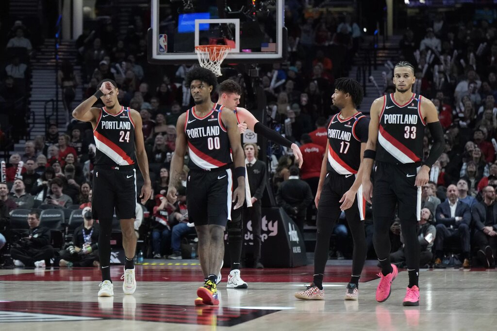 Portland Trail Blazers (from left to right) Kris Murray (24), Scoot Henderson (00), Donovan Clingan (23), Shaedon Sharpe (17) and Toumani Camara (33) walk back to the court after a timeout during the second half against the Brooklyn Nets at Moda Center. 