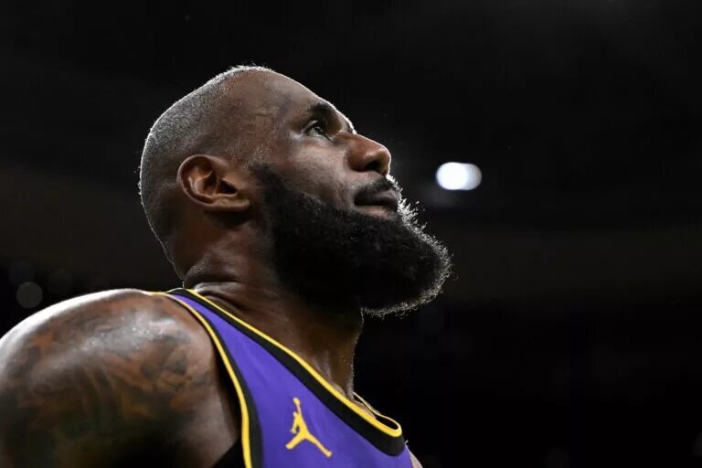 Mar 8, 2025; Boston, Massachusetts, USA; Los Angeles Lakers forward LeBron James (23) looks into the crowd during a timeout in the fourth quarter of a game against the Boston Celtics at the TD Garden. Mandatory Credit: Brian Fluharty-Imagn Images