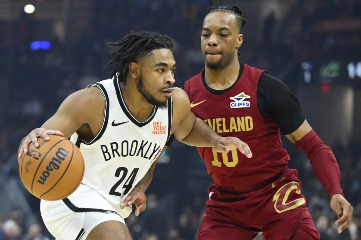 Mar 11, 2025; Cleveland, Ohio, USA; Brooklyn Nets guard Cam Thomas (24) dribbles beside Cleveland Cavaliers guard Darius Garland (10) in the first quarter at Rocket Arena. Mandatory Credit: David Richard-Imagn Images