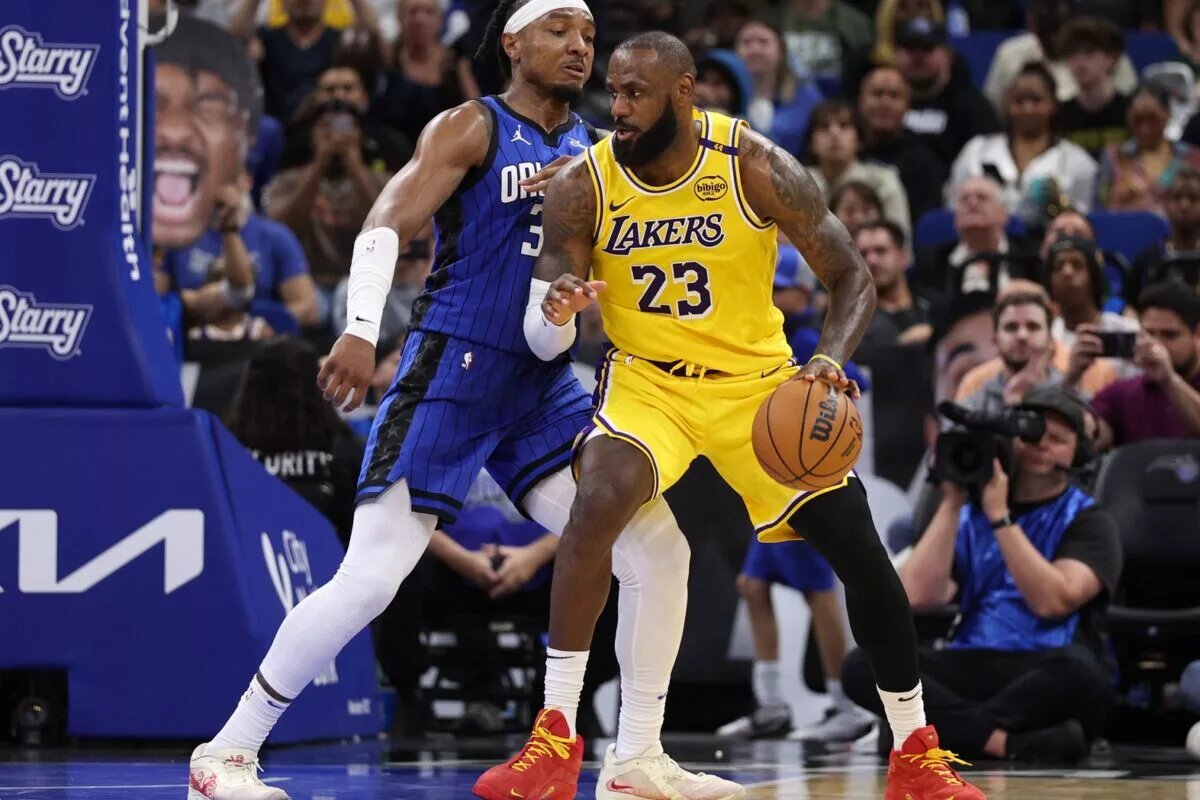 Mar 24, 2025; Orlando, Florida, USA; Los Angeles Lakers forward LeBron James (23) controls the ball against the Orlando Magic in the third quarter at Kia Center. Mandatory Credit: Nathan Ray Seebeck-Imagn Images