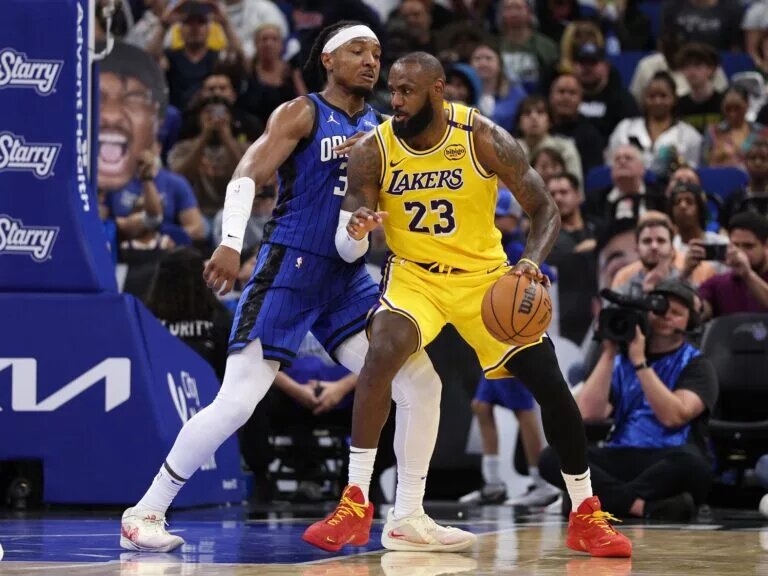 Mar 24, 2025; Orlando, Florida, USA; Los Angeles Lakers forward LeBron James (23) controls the ball against the Orlando Magic in the third quarter at Kia Center. Mandatory Credit: Nathan Ray Seebeck-Imagn Images
