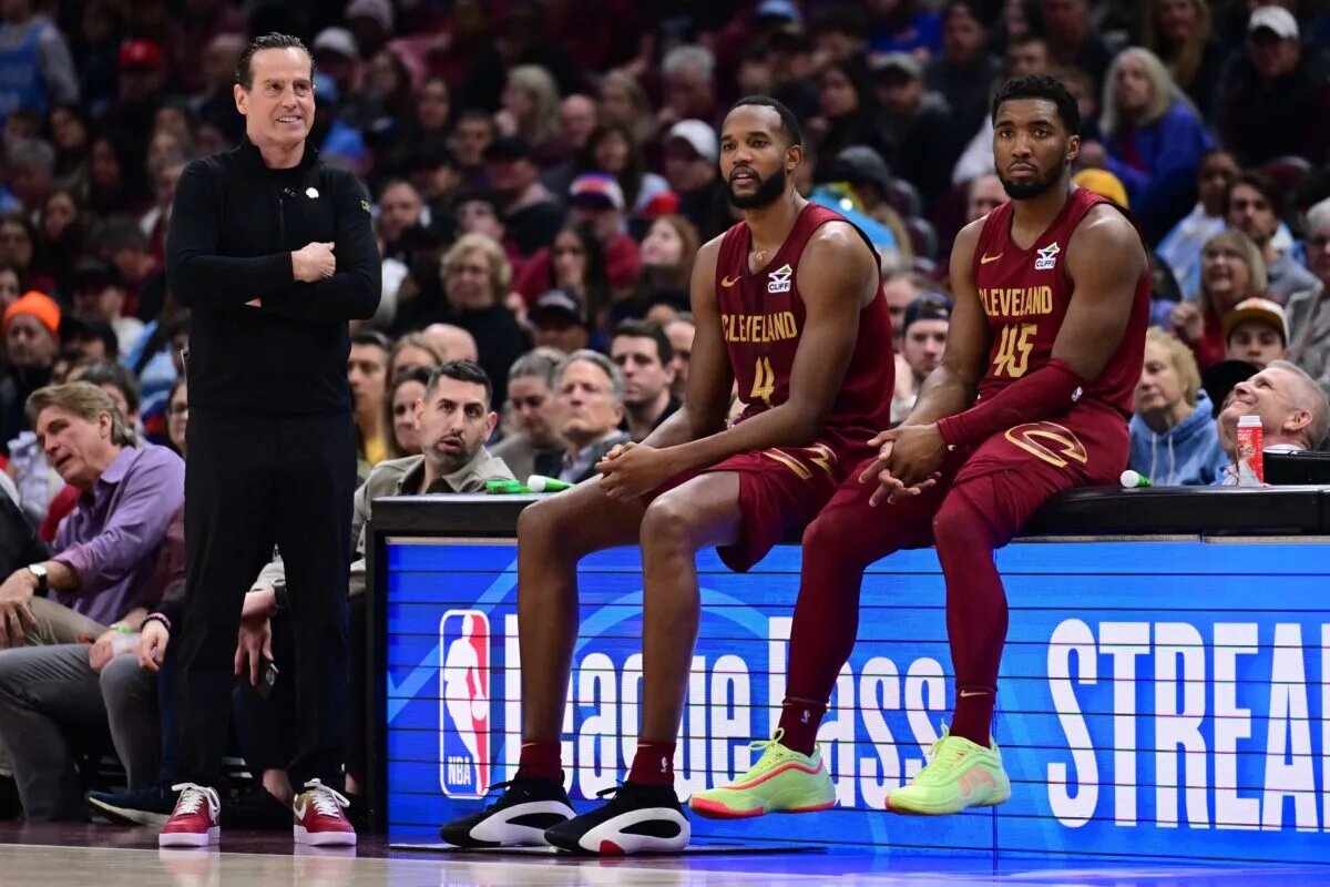 Apr 2, 2025; Cleveland, Ohio, USA; Cleveland Cavaliers forward Evan Mobley (4) and guard Donovan Mitchell (45) wait along side head coach Kenny Atkinson to enter the game during the first half against the New York Knicks at Rocket Arena. Mandatory Credit: Ken Blaze-Imagn Images