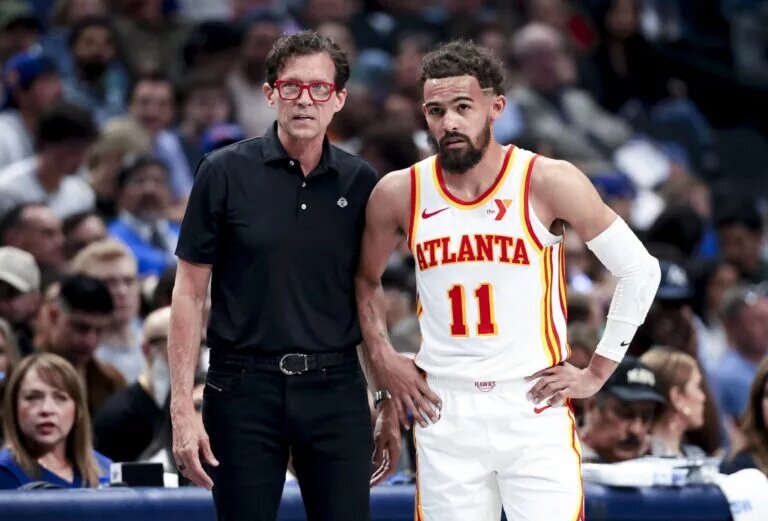 Apr 2, 2025; Dallas, Texas, USA; Atlanta Hawks head coach Quin Snyder speaks with Atlanta Hawks guard Trae Young (11) during the first half against the Dallas Mavericks at American Airlines Center. Mandatory Credit: Kevin Jairaj-Imagn Images