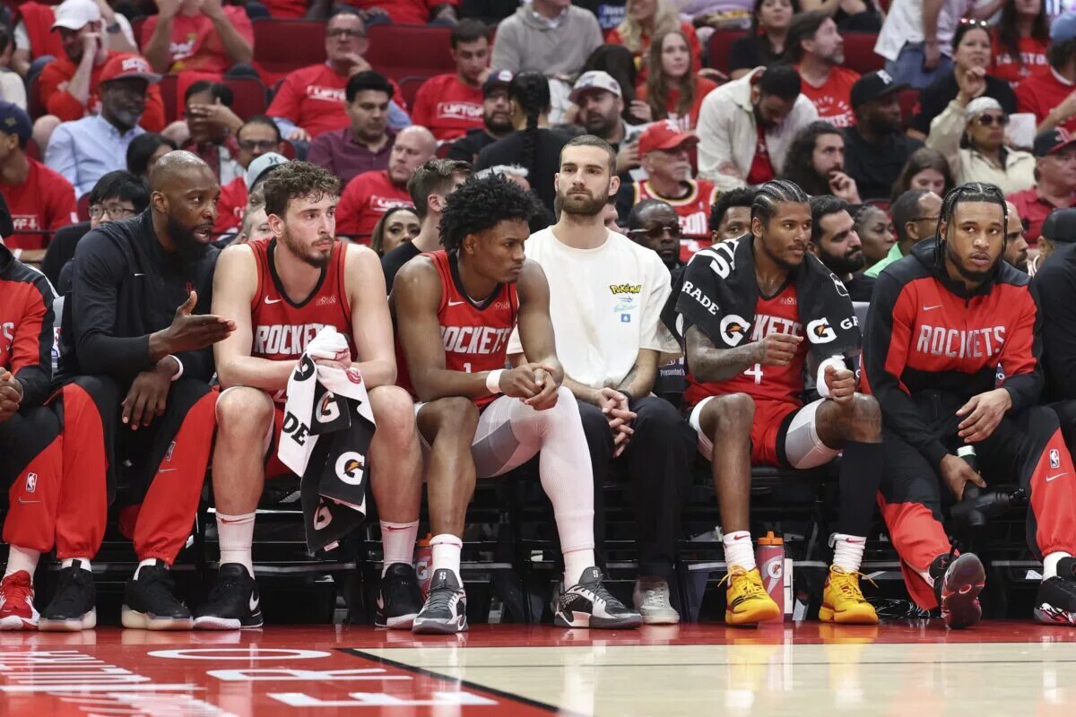 Houston Rockets center Alperen Sengun (28) and forward Amen Thompson (1) and guard Jalen Green