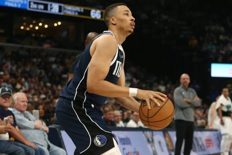 Apr 18, 2025; Memphis, Tennessee, USA; Dallas Mavericks guard Dante Exum (0) shoots for three during the second quarter against the Memphis Grizzlies at FedExForum. Mandatory Credit: Petre Thomas-Imagn Images