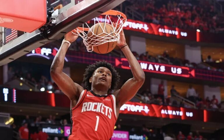 Houston Rockets forward Amen Thompson (1) dunks against the Golden State Warriors in the fourth quarter during game five of first round for the 2025 NBA Playoffs at Toyota Center.