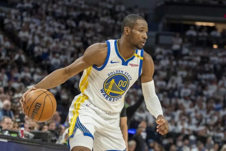 May 8, 2025; Minneapolis, Minnesota, USA; Golden State Warriors forward Jonathan Kuminga (00) dribbles the ball against the Minnesota Timberwolves in the second half during game two of the second round for the 2025 NBA Playoffs at Target Center. Mandatory Credit: Jesse Johnson-Imagn Images