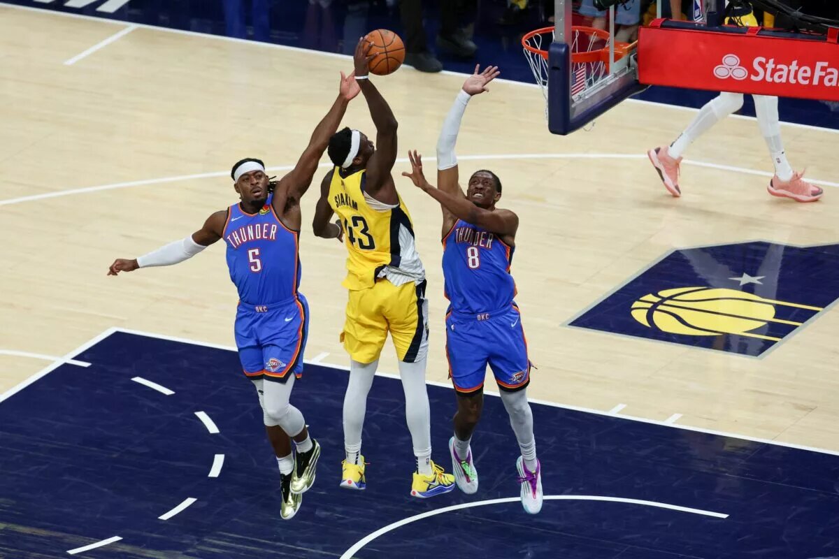 Jun 19, 2025; Indianapolis, Indiana, USA; Indiana Pacers forward Pascal Siakam (43) shoots the ball defended by Oklahoma City Thunder guard Luguentz Dort (5) and Oklahoma City Thunder forward Jalen Williams (8) in the second quarter during game six of the 2025 NBA Finals at Gainbridge Fieldhouse. Mandatory Credit: Trevor Ruszkowski-Imagn Images