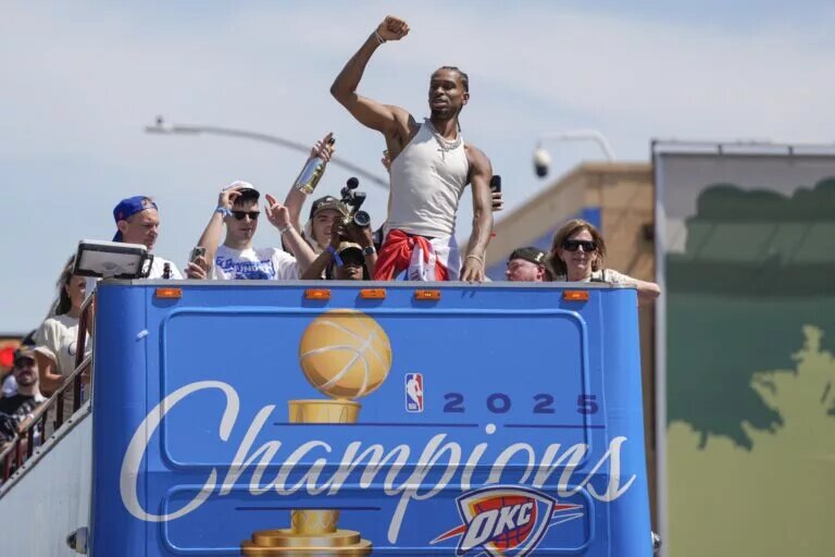 Oklahoma City Thunder guard Shai Gilgeous-Alexander gestures to the crowd as the Oklahoma City Thunder celebrate their first NBA Finals title win with a champions parade throughout downtown Oklahoma City on Tuesday, June 24, 2025. Mandatory Credit: Bryan Terry/USA TODAY NETWORK via Imagn Images