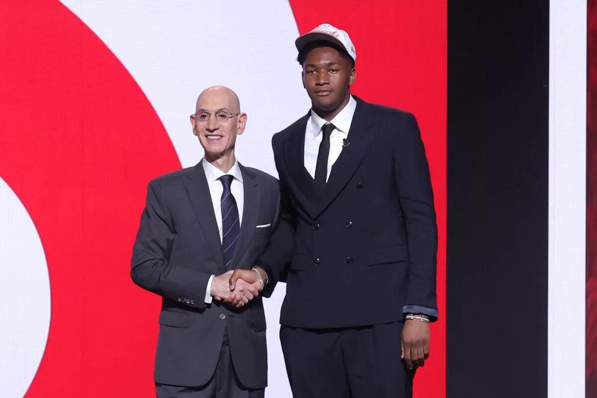 Jun 25, 2025; Brooklyn, NY, USA; Derik Queen stands with NBA commissioner Adam Silver after being selected as the 13th pick by the Atlanta Hawks in the first round of the 2025 NBA Draft at Barclays Center. Mandatory Credit: Brad Penner-Imagn Images