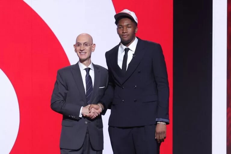 Jun 25, 2025; Brooklyn, NY, USA; Derik Queen stands with NBA commissioner Adam Silver after being selected as the 13th pick by the Atlanta Hawks in the first round of the 2025 NBA Draft at Barclays Center. Mandatory Credit: Brad Penner-Imagn Images