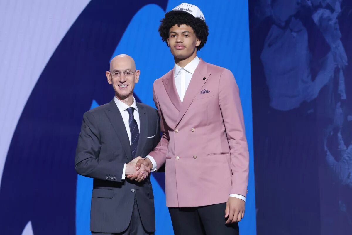 Jun 25, 2025; Brooklyn, NY, USA; Joan Beringer stands with NBA commissioner Adam Silver after being selected as the 17th pick by the Minnesota Timberwolves in the first round of the 2025 NBA Draft at Barclays Center. Mandatory Credit: Brad Penner-Imagn Images