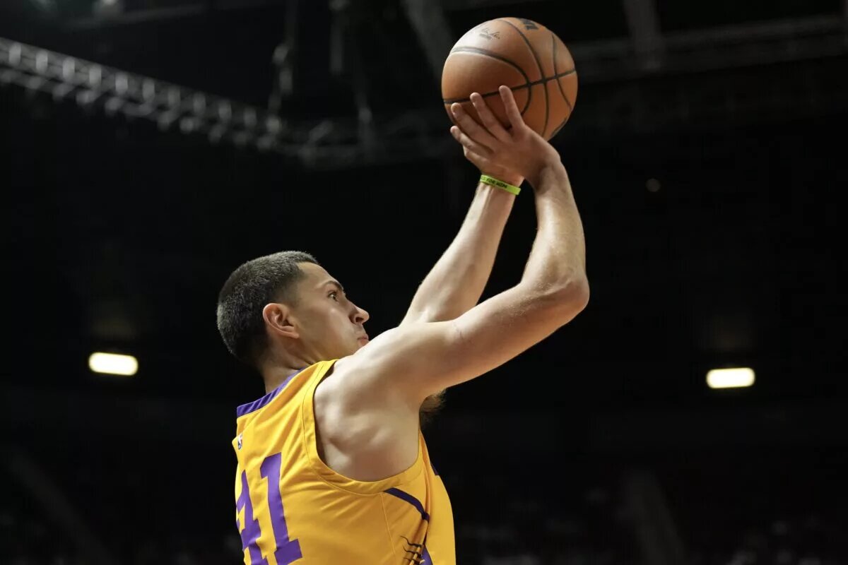 Jul 10, 2025; Las Vegas, NV, USA; Los Angeles Lakers forward Cole Swider (41) shoots a three point basket against the Dallas Mavericks in the third quarter of their game at Thomas & Mack Center. Mandatory Credit: Candice Ward-Imagn Images
