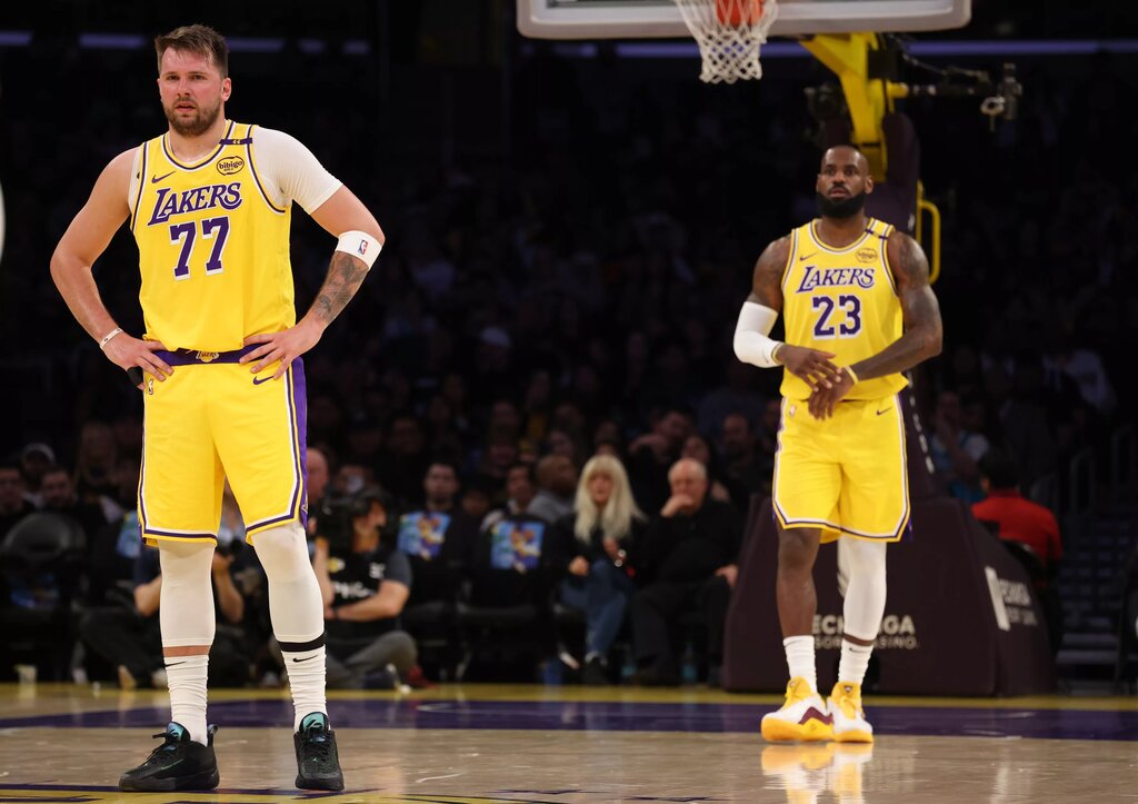 Los Angeles Lakers forward LeBron James (23) and guard Luka Doncic (77) during the first quarter against the Charlotte Hornets