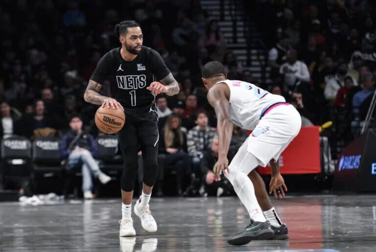 Brooklyn Nets guard D'Angelo Russell (1) controls the ball against Miami Heat forward Haywood Highsmith (24)