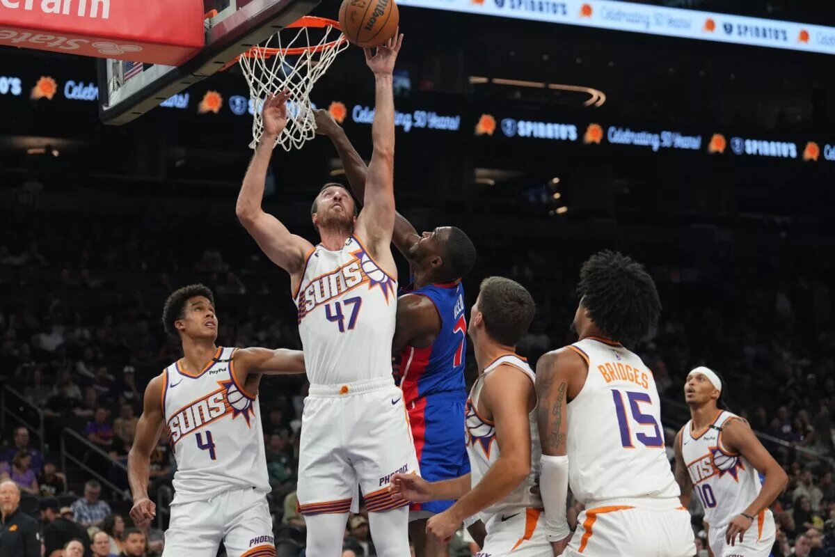 Oct 11, 2024; Phoenix, Arizona, USA; Phoenix Suns forward Frank Kaminsky (47) and Detroit Pistons forward Paul Reed (7) battle for a rebound during the second half at Footprint Center. Mandatory Credit: Joe Camporeale-Imagn Images
