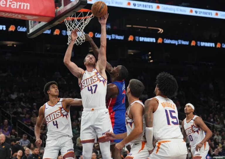 Oct 11, 2024; Phoenix, Arizona, USA; Phoenix Suns forward Frank Kaminsky (47) and Detroit Pistons forward Paul Reed (7) battle for a rebound during the second half at Footprint Center. Mandatory Credit: Joe Camporeale-Imagn Images