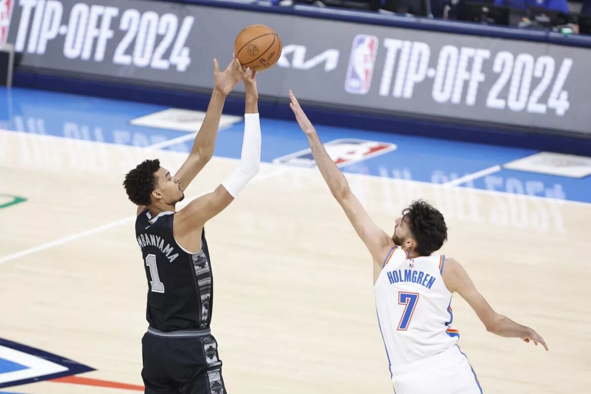 Oct 30, 2024; Oklahoma City, Oklahoma, USA; San Antonio Spurs center Victor Wembanyama (1) shoots as Oklahoma City Thunder forward Chet Holmgren (7) defends during the first quarter at Paycom Center. Mandatory Credit: Alonzo Adams-Imagn Images