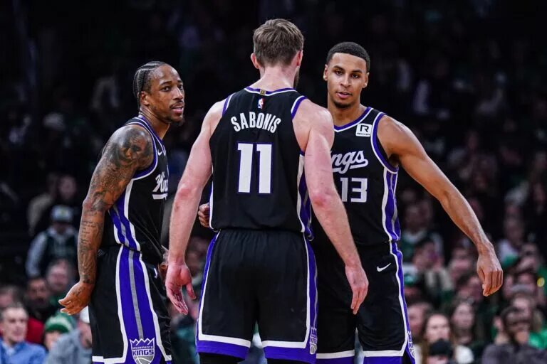 Sacramento Kings forward DeMar DeRozan (10), forward Keegan Murray (13) and forward Domantas Sabonis