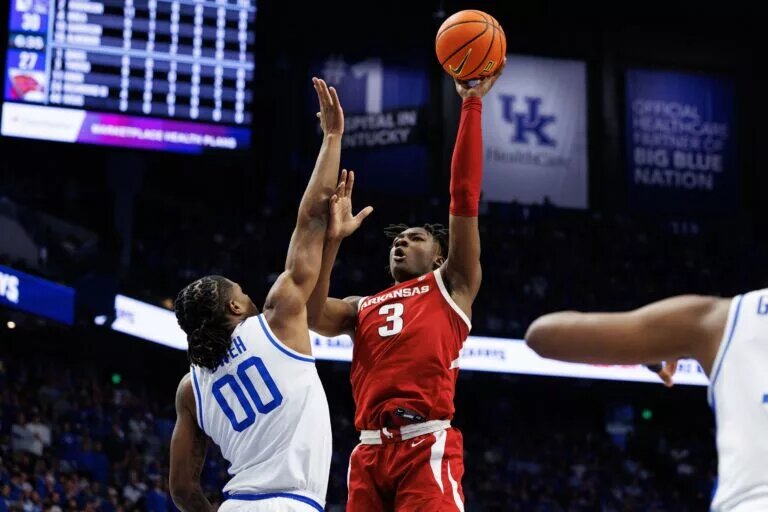 Feb 1, 2025; Lexington, Kentucky, USA; Arkansas Razorbacks forward Adou Thiero (3) shoots the ball over Kentucky Wildcats guard Otega Oweh (00) during the first half at Rupp Arena at Central Bank Center. Mandatory Credit: Jordan Prather-Imagn Images
