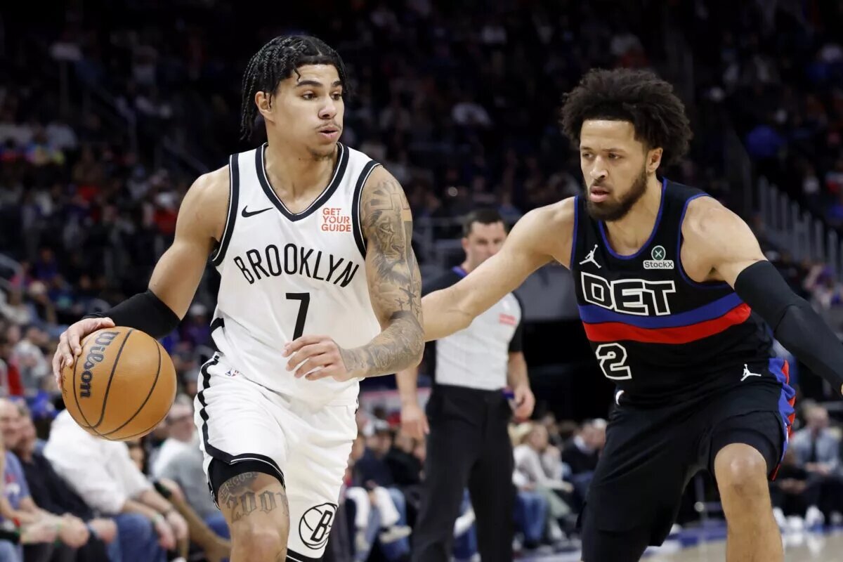 Mar 1, 2025; Detroit, Michigan, USA; Brooklyn Nets guard Killian Hayes (7) dribbles defended by Detroit Pistons guard Cade Cunningham (2) in the first half at Little Caesars Arena. Mandatory Credit: Rick Osentoski-Imagn Images