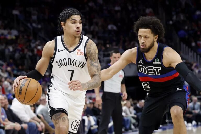 Mar 1, 2025; Detroit, Michigan, USA; Brooklyn Nets guard Killian Hayes (7) dribbles defended by Detroit Pistons guard Cade Cunningham (2) in the first half at Little Caesars Arena. Mandatory Credit: Rick Osentoski-Imagn Images