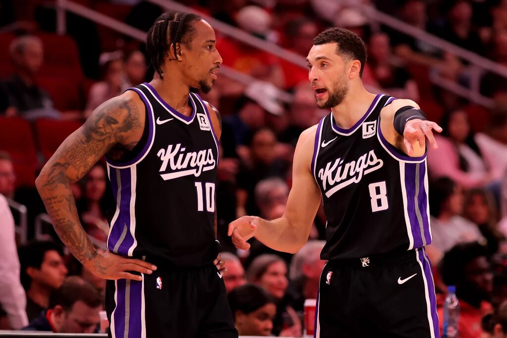 Sacramento Kings forward DeMar DeRozan (10) talks with guard Zach LaVine