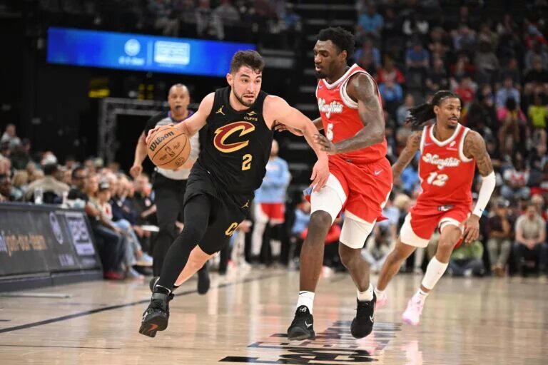 Mar 14, 2025; Memphis, Tennessee, USA; Cleveland Cavaliers shooting guard Ty Jerome (2) drives past defender Memphis Grizzlies guard Vince Williams Jr. (5) in the 4th quarter of the Cleveland Cavaliers vs. Memphis Grizzlies game at FedExForum. Mandatory Credit: Matthew Smith-Imagn Images