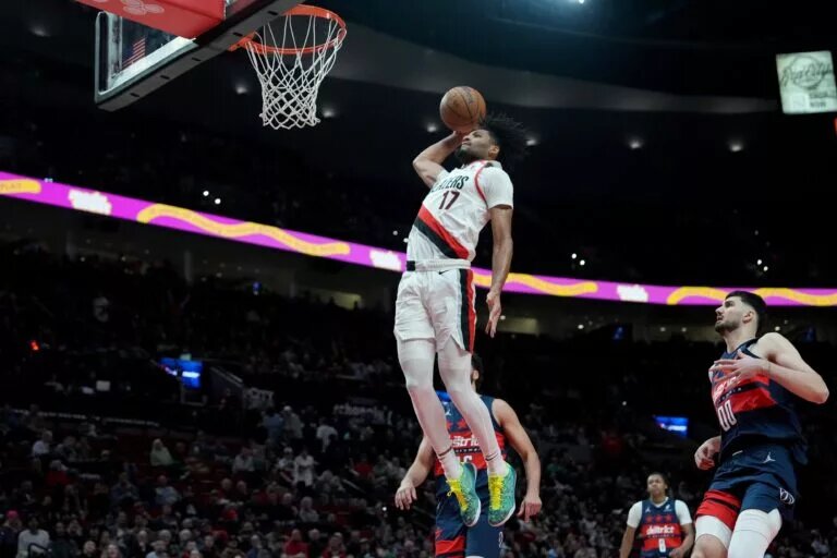 Mar 17, 2025; Portland, Oregon, USA; Portland Trail Blazers shooting guard Shaedon Sharpe (17) goes up for a dunk during the second half against the Washington Wizards at Moda Center. Mandatory Credit: Soobum Im-Imagn Images