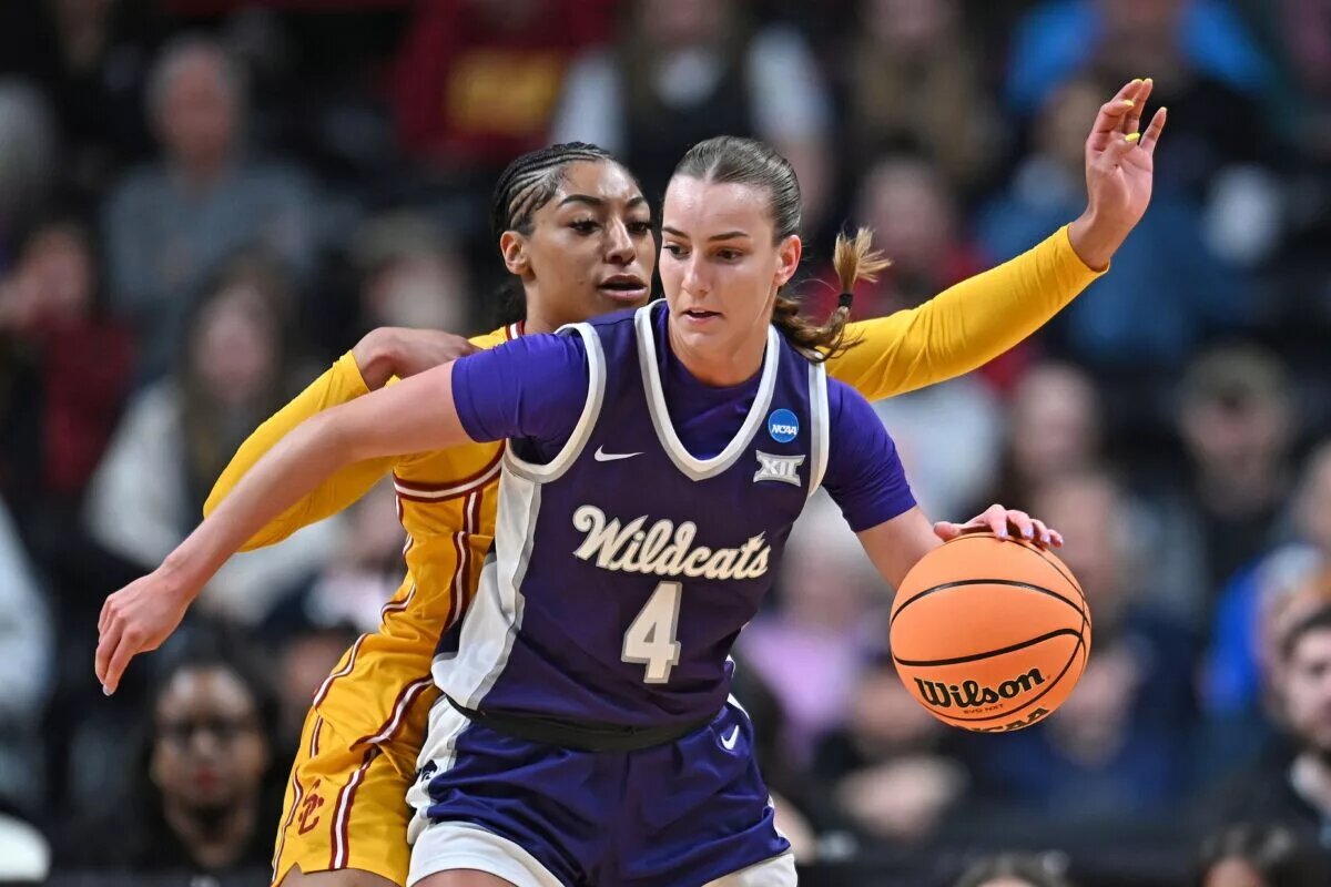 Mar 29, 2025; Spokane, WA, USA; Kansas State Wildcats guard Serena Sundell (4) controls the ball against USC Trojans guard Kennedy Smith (11) during the first half of a Sweet 16 NCAA Tournament basketball game at Spokane Arena. at Spokane Arena. Mandatory Credit: James Snook-Imagn Images