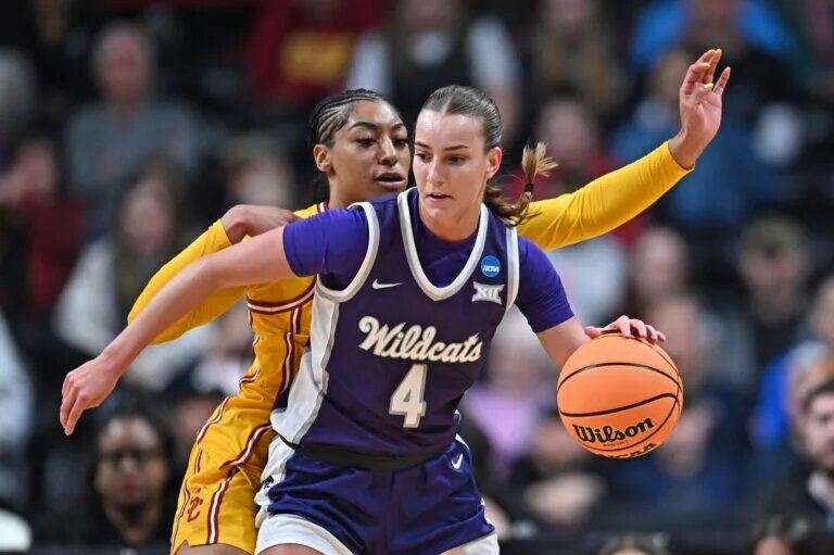 Mar 29, 2025; Spokane, WA, USA; Kansas State Wildcats guard Serena Sundell (4) controls the ball against USC Trojans guard Kennedy Smith (11) during the first half of a Sweet 16 NCAA Tournament basketball game at Spokane Arena. at Spokane Arena. Mandatory Credit: James Snook-Imagn Images