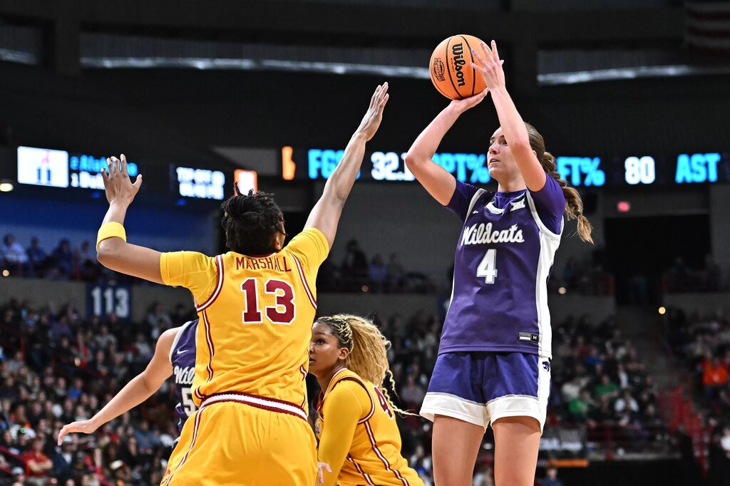 Mar 29, 2025; Spokane, WA, USA; Kansas State Wildcats guard Serena Sundell (4) shoots against USC Trojans center Rayah Marshall (13) during the first half of a Sweet 16 NCAA Tournament basketball game at Spokane Arena. Mandatory Credit: James Snook-Imagn Images
