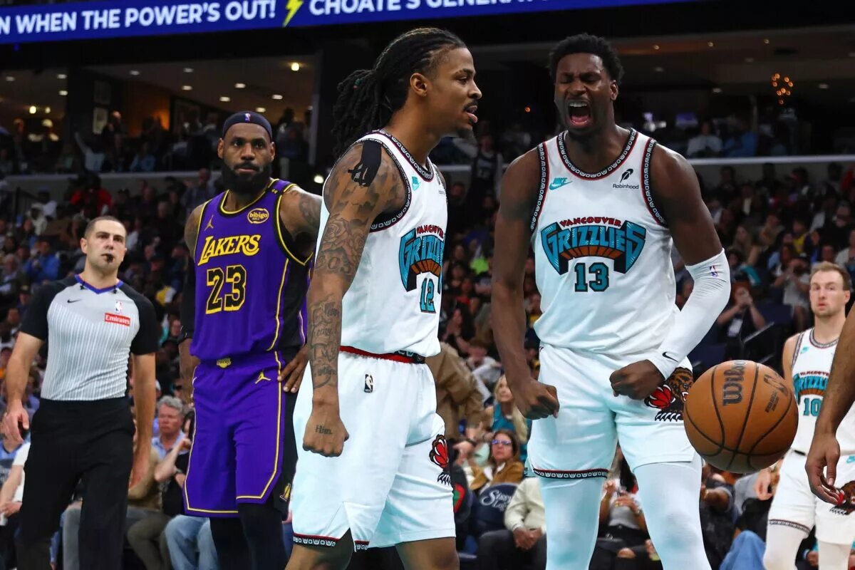 Mar 29, 2025; Memphis, Tennessee, USA; Memphis Grizzlies guard Ja Morant (12) and forward Jaren Jackson Jr. (13) react during the third quarter against the Los Angeles Lakers at FedExForum. Mandatory Credit: Petre Thomas-Imagn Images
