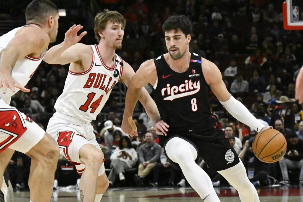 Apr 4, 2025; Chicago, Illinois, USA; Portland Trail Blazers forward Deni Avdija (8) moves the ball against Chicago Bulls forward Matas Buzelis (14) during the first half at United Center. Mandatory Credit: Matt Marton-Imagn Images