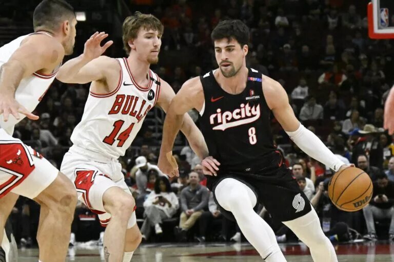 Apr 4, 2025; Chicago, Illinois, USA; Portland Trail Blazers forward Deni Avdija (8) moves the ball against Chicago Bulls forward Matas Buzelis (14) during the first half at United Center. Mandatory Credit: Matt Marton-Imagn Images