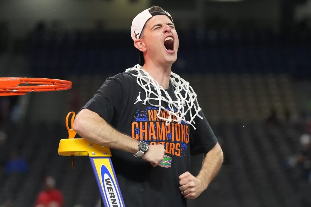 Apr 7, 2025; San Antonio, TX, USA; Florida Gators head coach Todd Golden celebrates as he cuts down the net after defeating the Houston Cougars in the national championship game of the Final Four of the 2025 NCAA Tournament at the Alamodome. Mandatory Credit: Robert Deutsch-Imagn Images