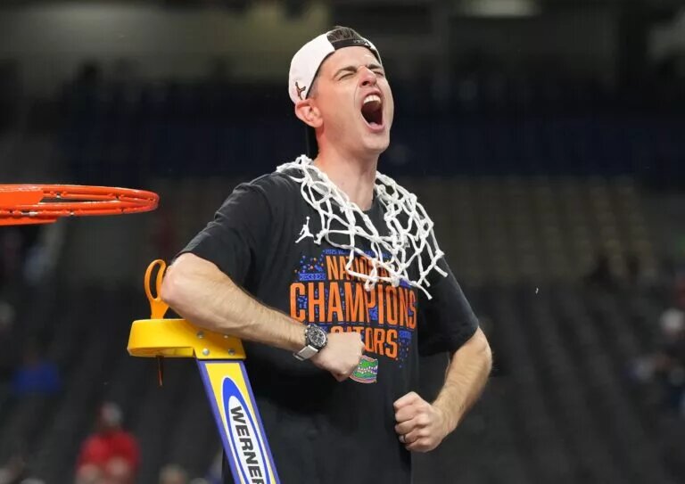 Apr 7, 2025; San Antonio, TX, USA; Florida Gators head coach Todd Golden celebrates as he cuts down the net after defeating the Houston Cougars in the national championship game of the Final Four of the 2025 NCAA Tournament at the Alamodome. Mandatory Credit: Robert Deutsch-Imagn Images